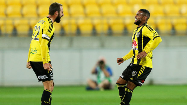 Andrew Durante and Kenny Cunningham celebrate Wellington's win over the Mariners.