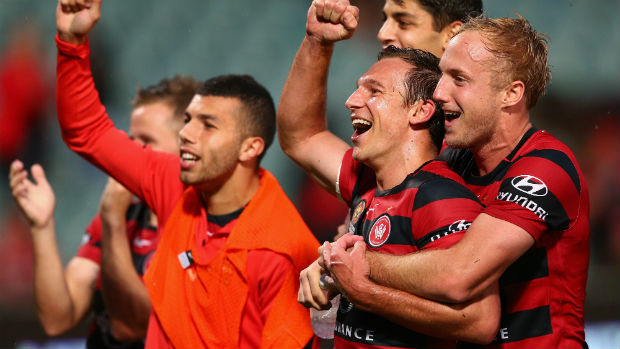 Wanderers players celebrate their Round 4 win over Perth Glory.
