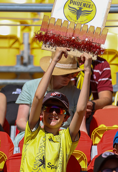 Picture of a fan holding a sign in the Macca's Junior Nix zone at the Phoenix men's game on 28 December 2024