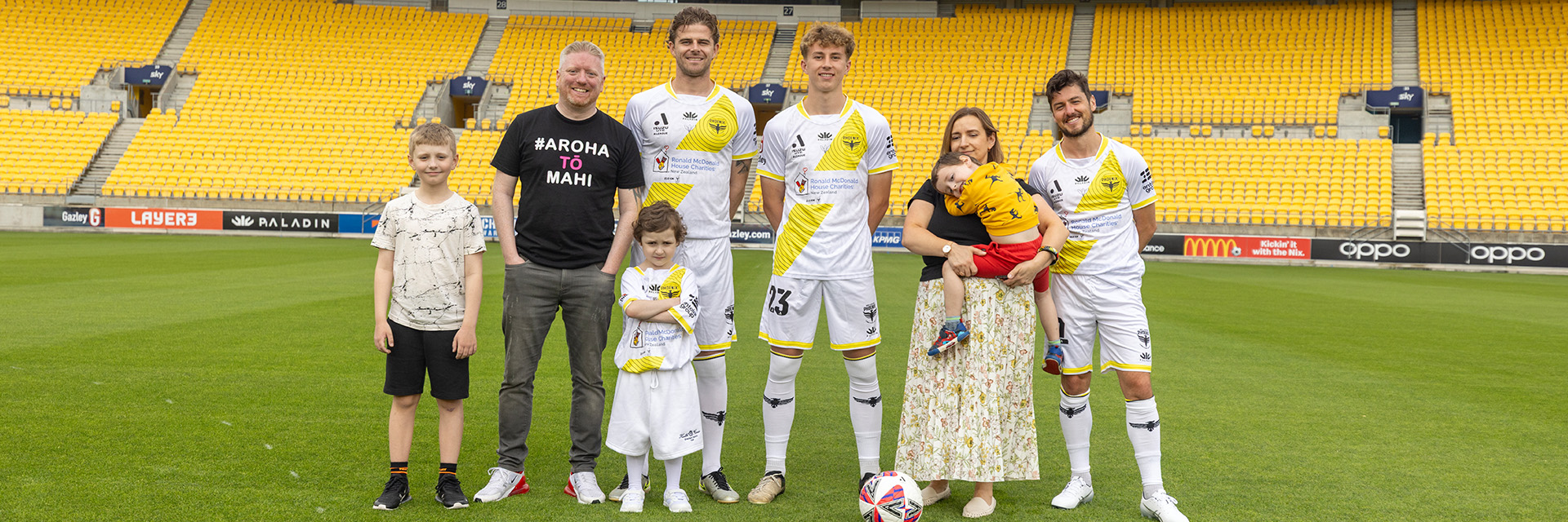 Wellington Phoenix charity round Mar 29. Harper family with Wellington Phoenix players at Sky Stadium